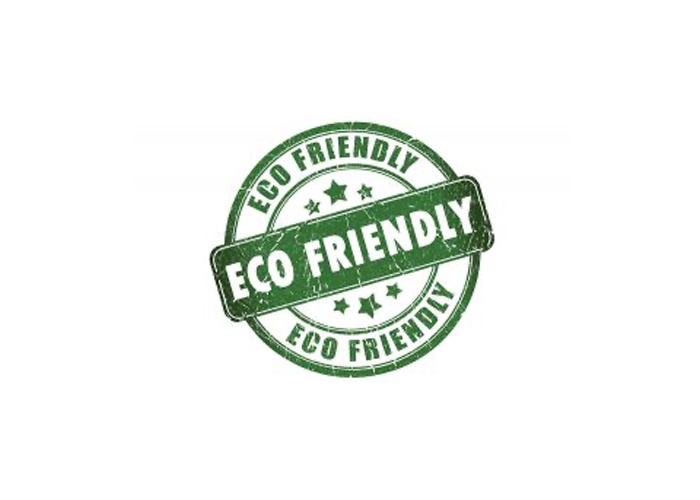 The image shows a circular stamp-like graphic with text around its perimeter reading  ECO FRIENDLY  at the top,  STAMP  in the center, and  ECO FRIENDLY  again at the bottom, all within a border that appears to be made of a green substance or paint. The background is white.
